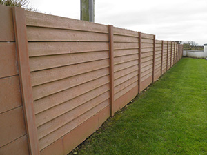 Timber effect post and panel fencing in brown. One of our most popular products. Get your order in today.